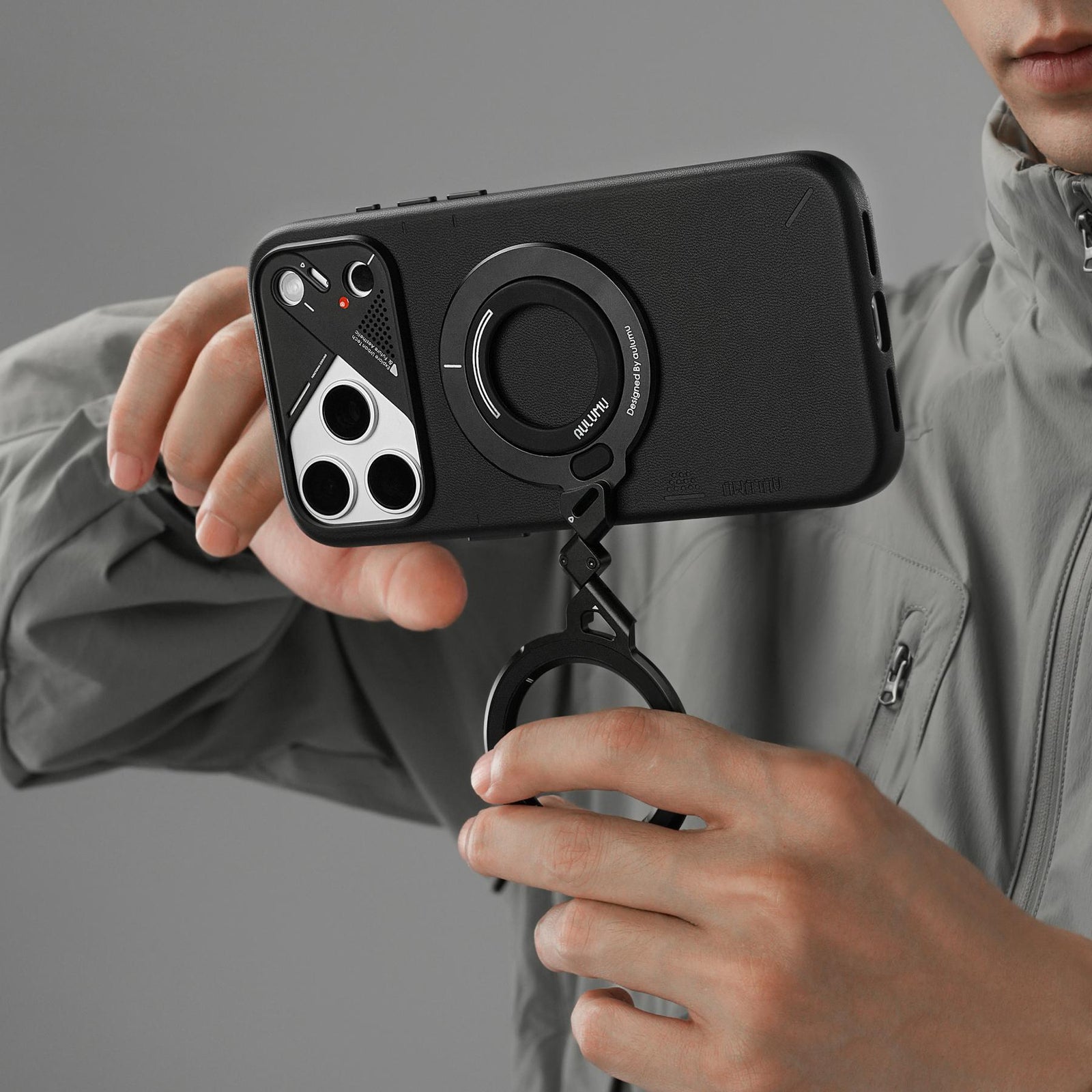 AULUMU G09 Infinite 360° MagSafe stand showcasing its three‑axis rotating ring design for hands‑free phone viewing.
