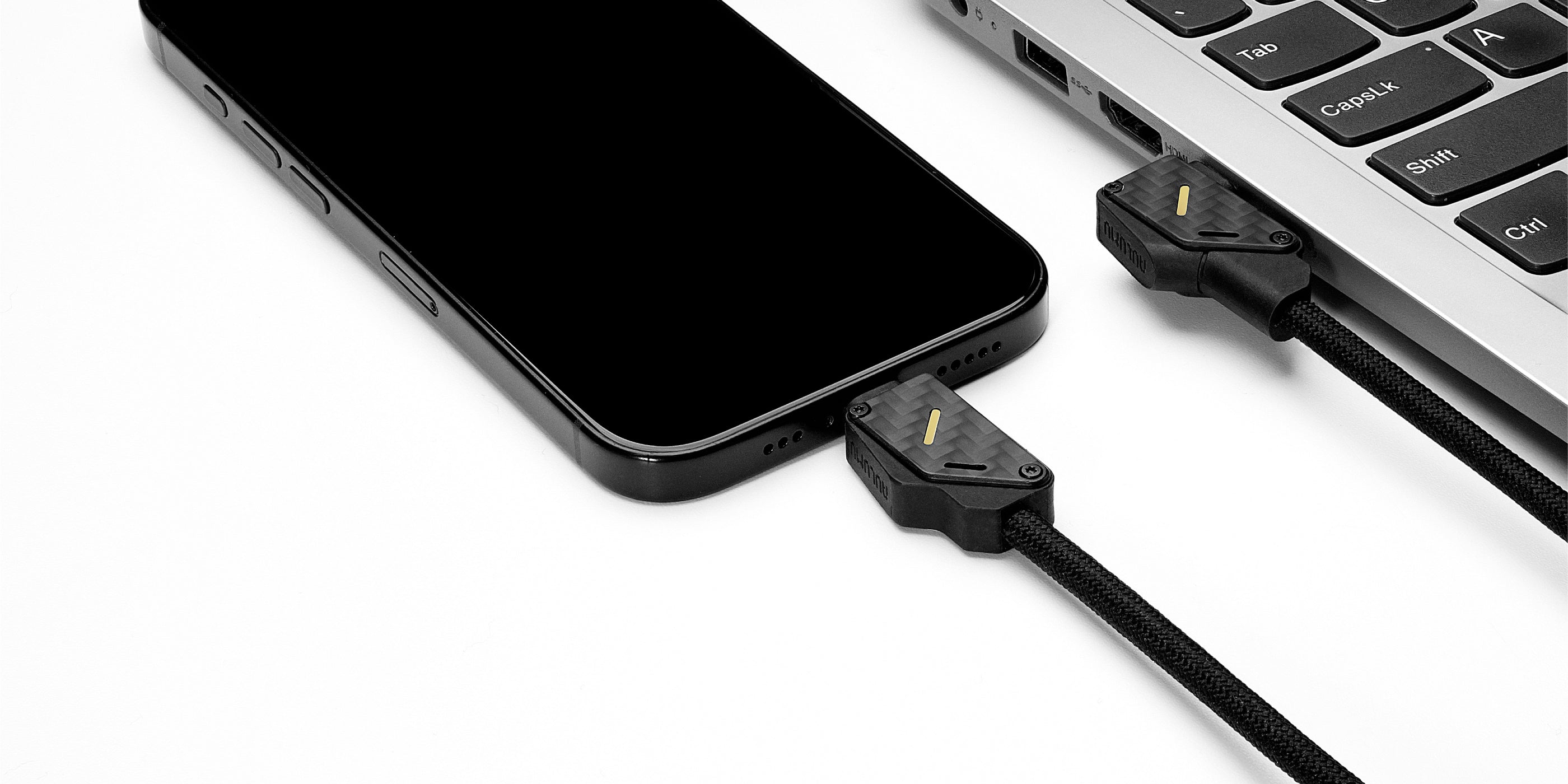 M07 carbon fiber USB-C cable connecting iPhone and laptop for fast data transfer